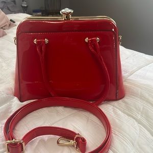 Beautiful patent leather red purse. Lots of room and very clean.